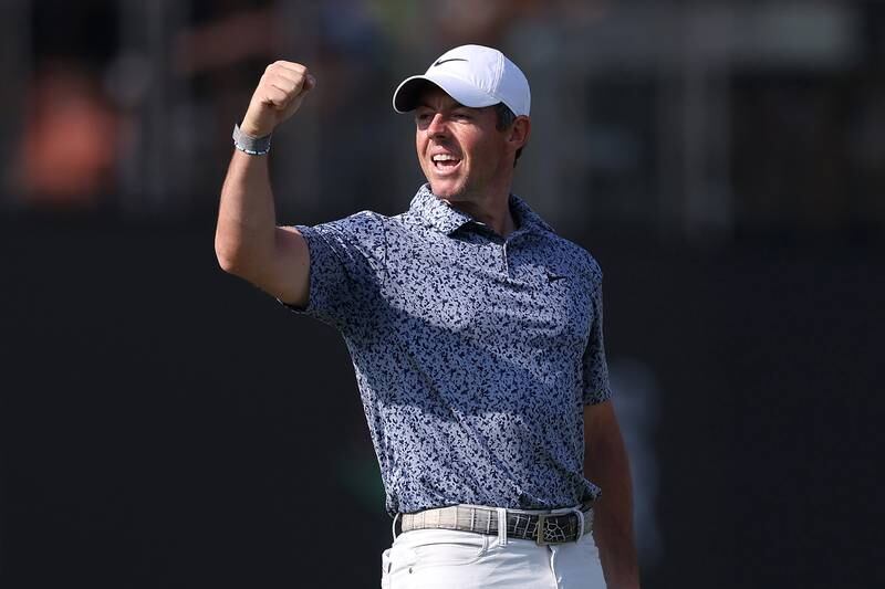Rory McIlroy celebrates victory on the 18th hole. Getty