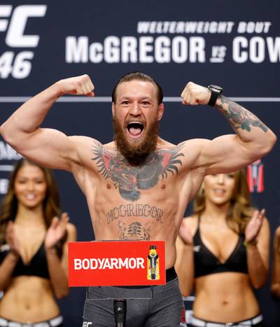 LAS VEGAS, NEVADA - JANUARY 17: Welterweight fighter Conor McGregor poses on the scale during a ceremonial weigh-in for UFC 246 at Park Theater at Park MGM on January 17, 2020 in Las Vegas, Nevada. McGregor will face Donald Cerrone at UFC 246 on January 18 in Las Vegas.   Steve Marcus/Getty Images/AFP