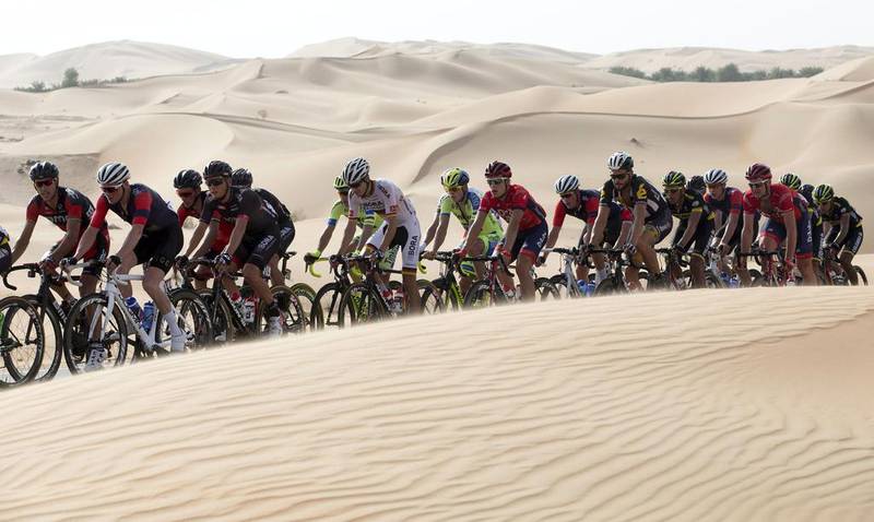 The peloton ride through the desert on Thursday during Stage 1 of the Abu Dhabi Tour. Claudio Peri / ANSA / AP