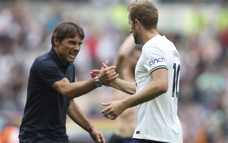 Tottenham coach Antonio Conte shakes hands with Harry Kane after the match. AP