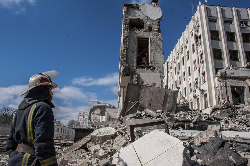 Rescuers work at the site of the National Academy of State Administration building damaged by shelling in Kharkiv. AP