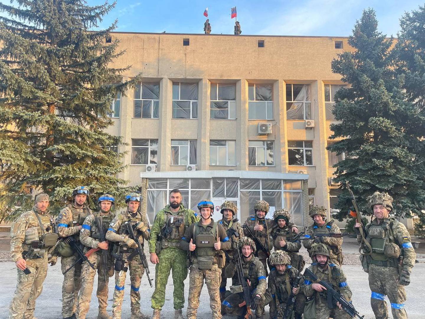 Ukrainian troops pose for a photo in Lyman, Ukraine. Reuters