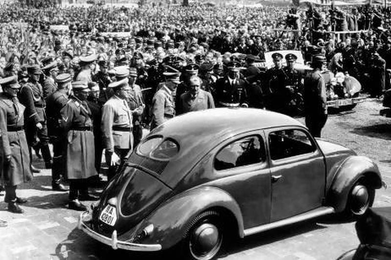 Hitler inspects the new people's car at the Fallensleben factory in 1938; on Hitler's left is the car's designer, Dr Ferdinand Porsche. Popperfoto / Getty Images