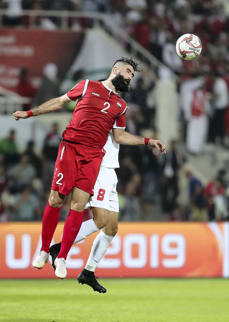 SHARJAH , UNITED ARAB EMIRATES , January  6 – 2019 :- Ahmad Alsaleh( no 2 in red ) of Syria in action during the AFC Asian Cup UAE 2019 football match between Syria vs Palestine held at Sharjah Football Stadium in Sharjah. ( Pawan Singh / The National ) For News/Sports