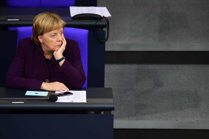 epa07978598 German Chancellor Angela Merkel looks on as she attends a session of the German parliament Bundestag in Berlin, Germany, 07 November 2019.  EPA/CLEMENS BILAN