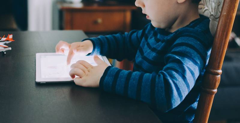 Parents should work with their children to come up with household rules regarding technology, such as no phones at mealtimes and choosing educational content over social media. Kelly Sikkema / Unsplash