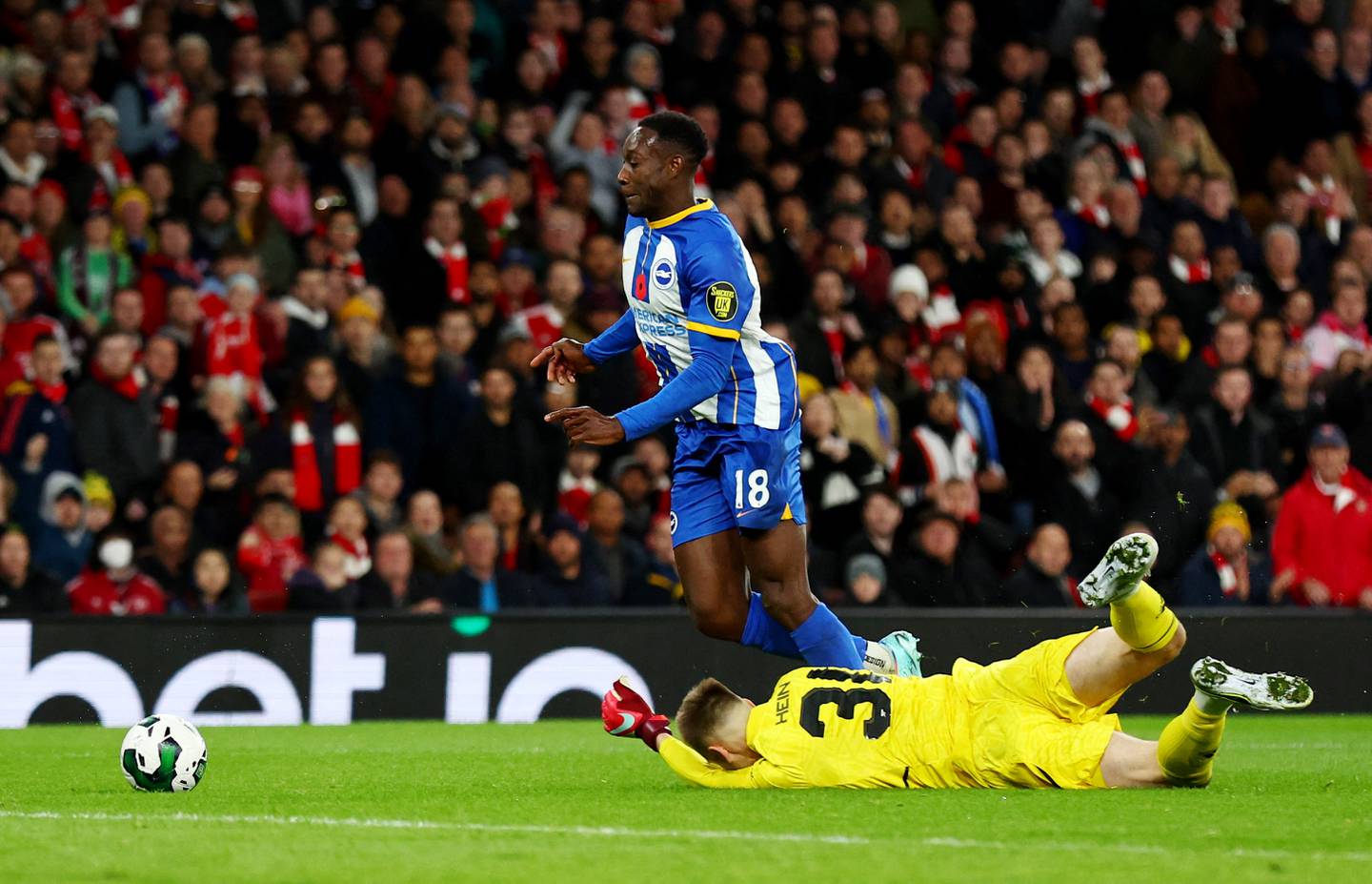 Brighton's Danny Welbeck is fouled by Arsenal's Karl Hein, resulting in a penalty. Reuters