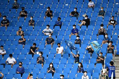 Football fans cheer during the South Korean K-League football match between Incheon United FC and Gwangju FC in Incheon. AFP