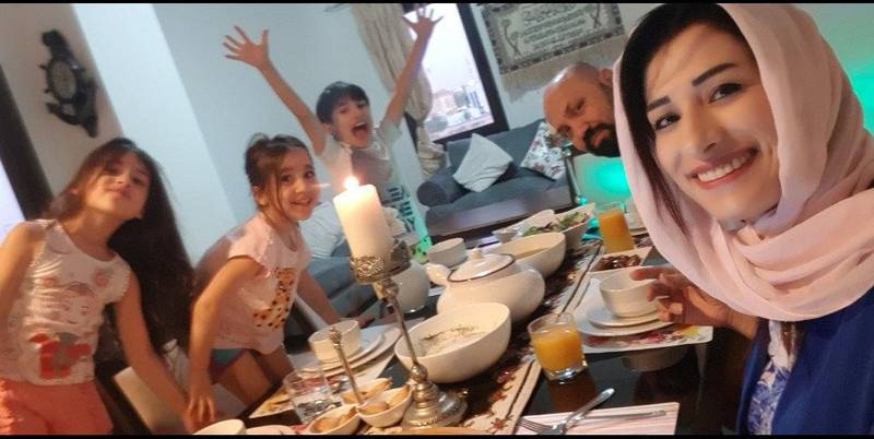 Nesreen Alabbas, an elementary Arabic teacher at American Academy for Girls, sits down for iftar with her family. Courtesy:Nesreen Alabbas