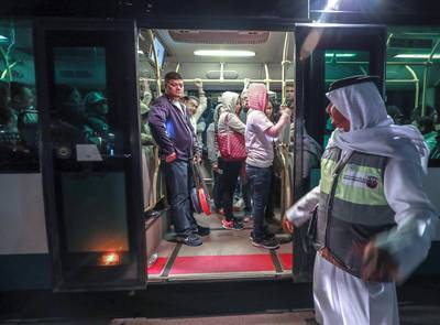 Abu Dhabi, U.A.E., February 5, 2019.   Worshipers heading onto buses at Nation Towers before they're transported to the mass.  RTA employees busy helping worshipers board the shuttles to the mass.Victor Besa/The NationalSection:  NAReporter: