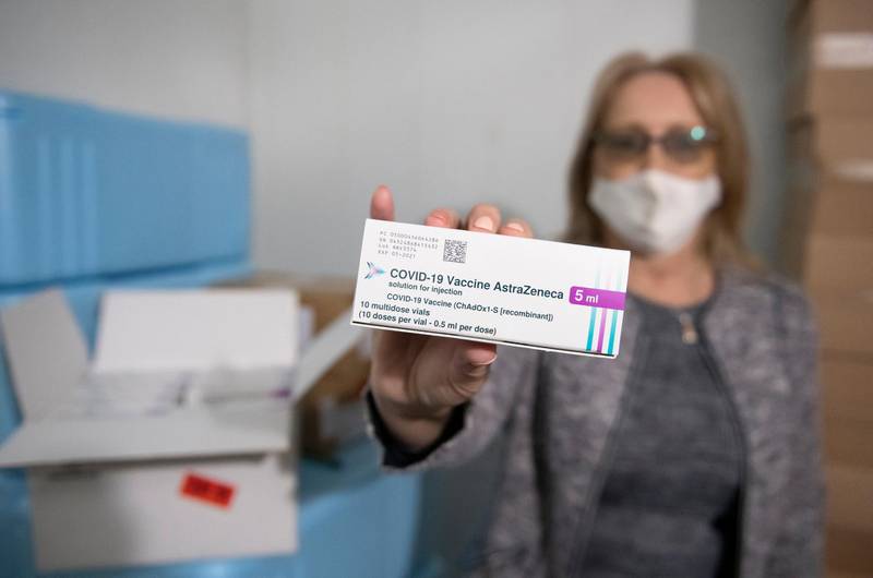Chief County Health Officer Tunde Szabo shows a box of Oxford/AstraZeneca vaccine at the freezing chamber of the Public Health Department in Nyiregyhaza, Hungary. AP Photo