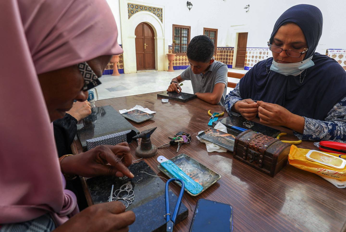 Libyans make traditional filigree jewellery at a workshop in the capital Tripoli. AFP