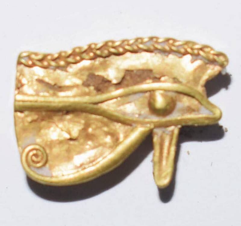 A solid gold eye of Horus unearthed at Egypt's Tel El Farain. The eye was a talisman believed to bring prosperity and protection to its holder.