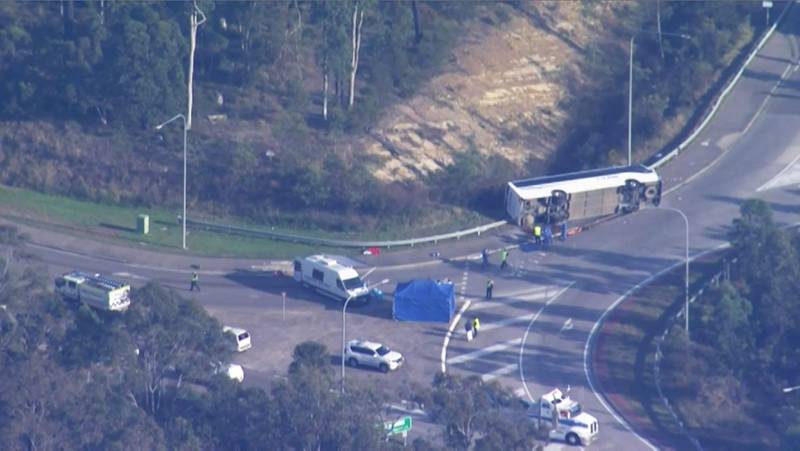 The bus lies on its side in a still from from video footage provided by the Australian Broadcasting Corporation. AFP