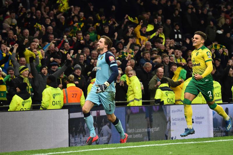 Norwich City goalkeeper Tim Krul celebrates with teammate Max Aarons after winning the penalty shootout. AFP