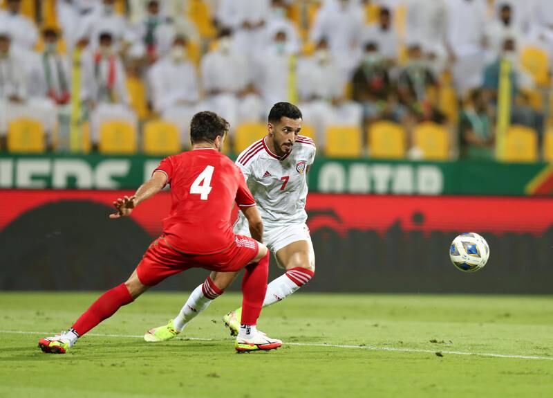 UAE's Ali Mabkhout takes on Shojae Khalilzadeh of Iran during the World Cup 2022 qualifier at  Zabeel Stadium in Dubai on Thursday, October 7. Chris Whiteoak / The National