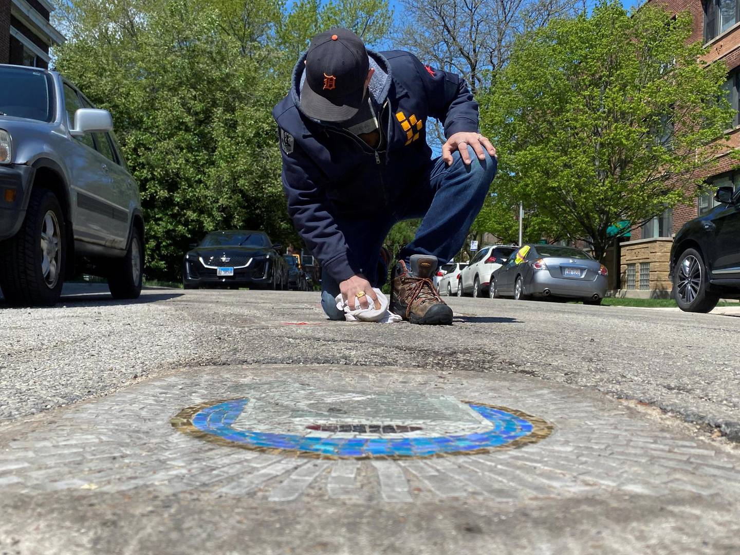 Chicago artist Jim Bachor creates four pandemic-themed pothole mosaics on the city's North Side, during the coronavirus disease (COVID-19) outbreak in Chicago, Illinois, U.S., May 20, 2020. Picture taken May 20, 2020. REUTERS/Brendan O'Brien