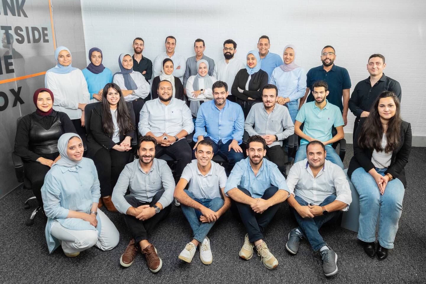 Sideup founder Waleed Rashed, seated, fourth from left, with team members.  Photo: Sideup
