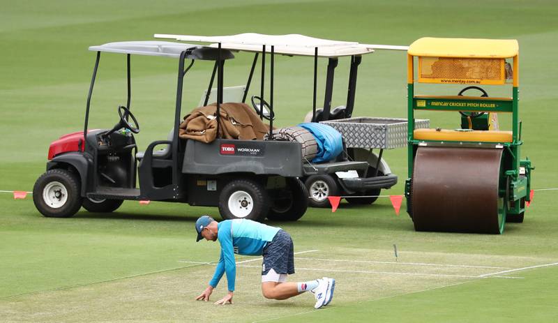 England captain Joe Root inspects the wicket during a nets session at The Gabba, Brisbane. PA