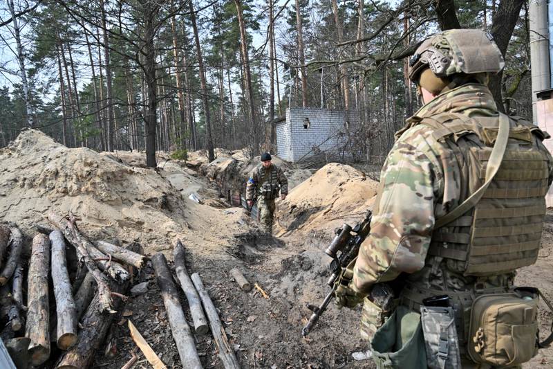 Ukrainian servicemen at a position along the front line north of the Ukrainian capital Kyiv. AFP