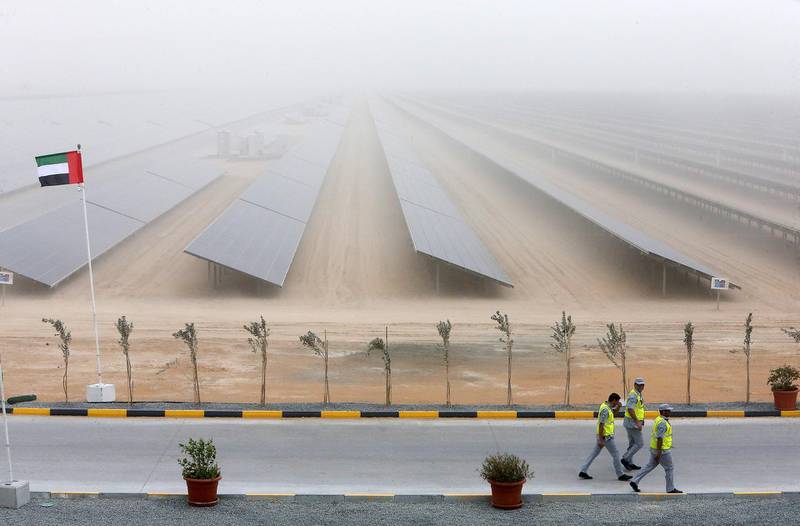 DUBAI , UNITED ARAB EMIRATES – March 20 , 2017 : View of the second phase of the Mohammed bin Rashid Al Maktoum Solar Park in Seih Al Dahal area in Dubai. ( Pawan Singh / The National ) For Business. Story by Andrew. ID No : 14206 *** Local Caption ***  PS2003- SOLAR PARK06.jpg