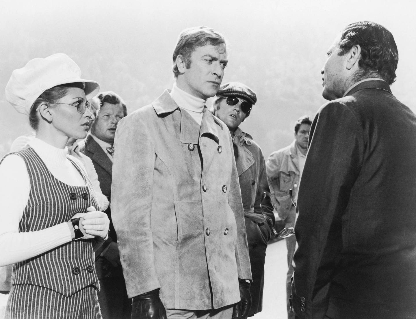 From left to right, Margaret Blye as Lorna, Benny Hill (1924 - 1992) as Professor Peach, Michael Caine as Charlie Croker, Michael Standing as Arthur and Raf Vallone (1916 - 2002) as Altabani in Paramount Pictures' 'The Italian Job', 1969. (Photo by Archive Photos/Getty Images)