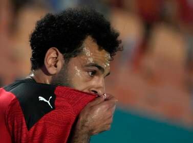Egypt's Mohamed Salah wipes his face during his team match with Guinea in Group D 2023 Cup of Nations (AFCON) qualifiers at Cairo International stadium in Cairo, Egypt, Sunday, June 5, 2022.  Egypt won 1-0.  (AP Photo / Amr Nabil)
