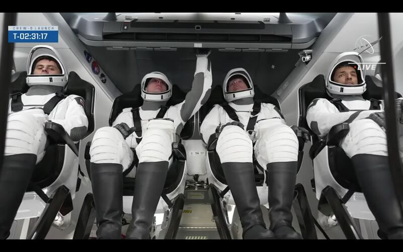 The crew board the Dragon spacecraft. Photo: Nasa