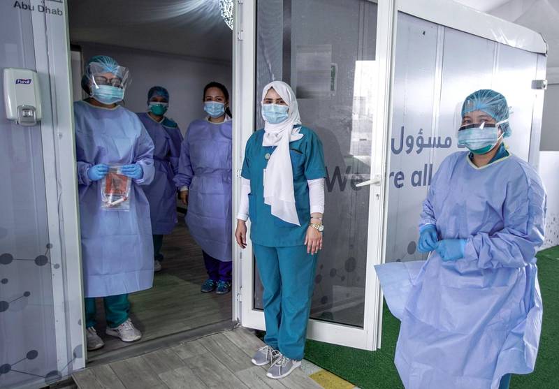 Dubai, United Arab Emirates, April 12, 2020.  The National Screening Center, Mina Rashed, Dubai.  Nurses smile for the camera while practicing social distancing.Victor Besa / The NationalSection:  NAReporter:  Nick Webster
