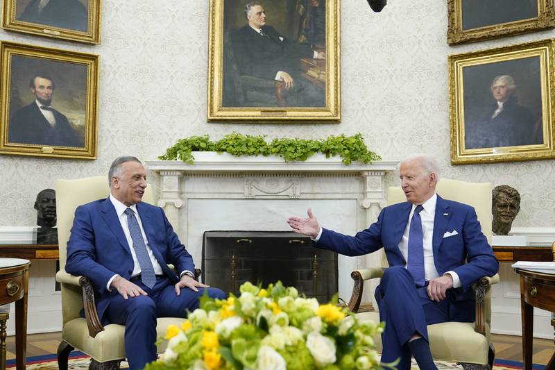 Iraqi Prime Minister Mustafa Al Kadhimi and US President Joe Biden during their meeting in the Oval Office of the White House in Washington on Monday. AP