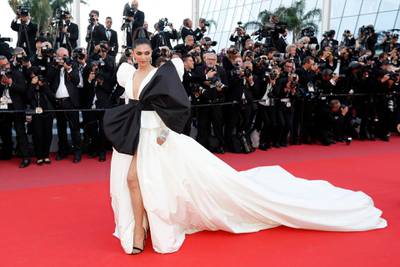 epa07576125 Deepika Padukone arrives for the screening of 'Rocketman' during the 72nd annual Cannes Film Festival, in Cannes, France, 16 May 2019. White dress with black bow by Dundas. The movie is presented out of competition at the festival which runs from 14 to 25 May.  EPA-EFE/GUILLAUME HORCAJUELO