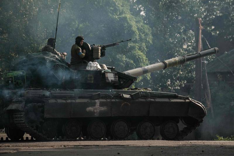 Ukrainian soliders drive a tank at the recently retaken eastern side of the Oskil River in Kharkiv region, Ukraine. AFP