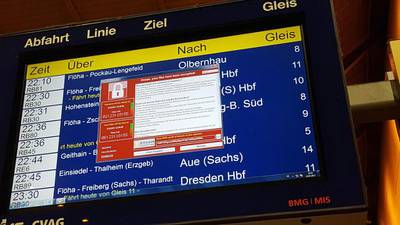 An electronic timetable display at a railway station in Chemnitz, eastern Germany, shows a ransom demand from hackers who struck in more than 90 countries on May 12, 2017. P Goetzelt / dpa / AFP