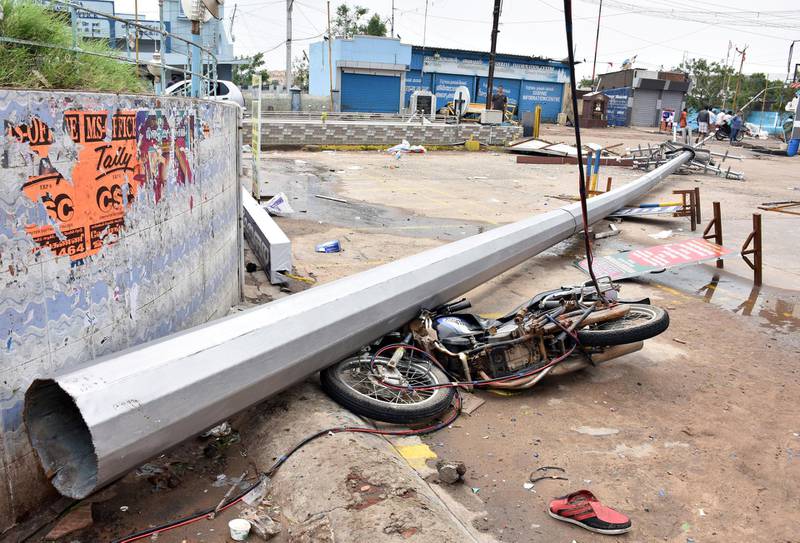 A fallen pole and a damaged motorbike are seen in a road after cyclone Gaja hit Velankanni, in Nagapattinam district in the southern state of Tamil Nadu, India, November 16, 2018. REUTERS/Stringer