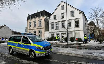 Police and security patrols at residential buildings that are placed under quarantine in Hamm, western Germany. AP Photo