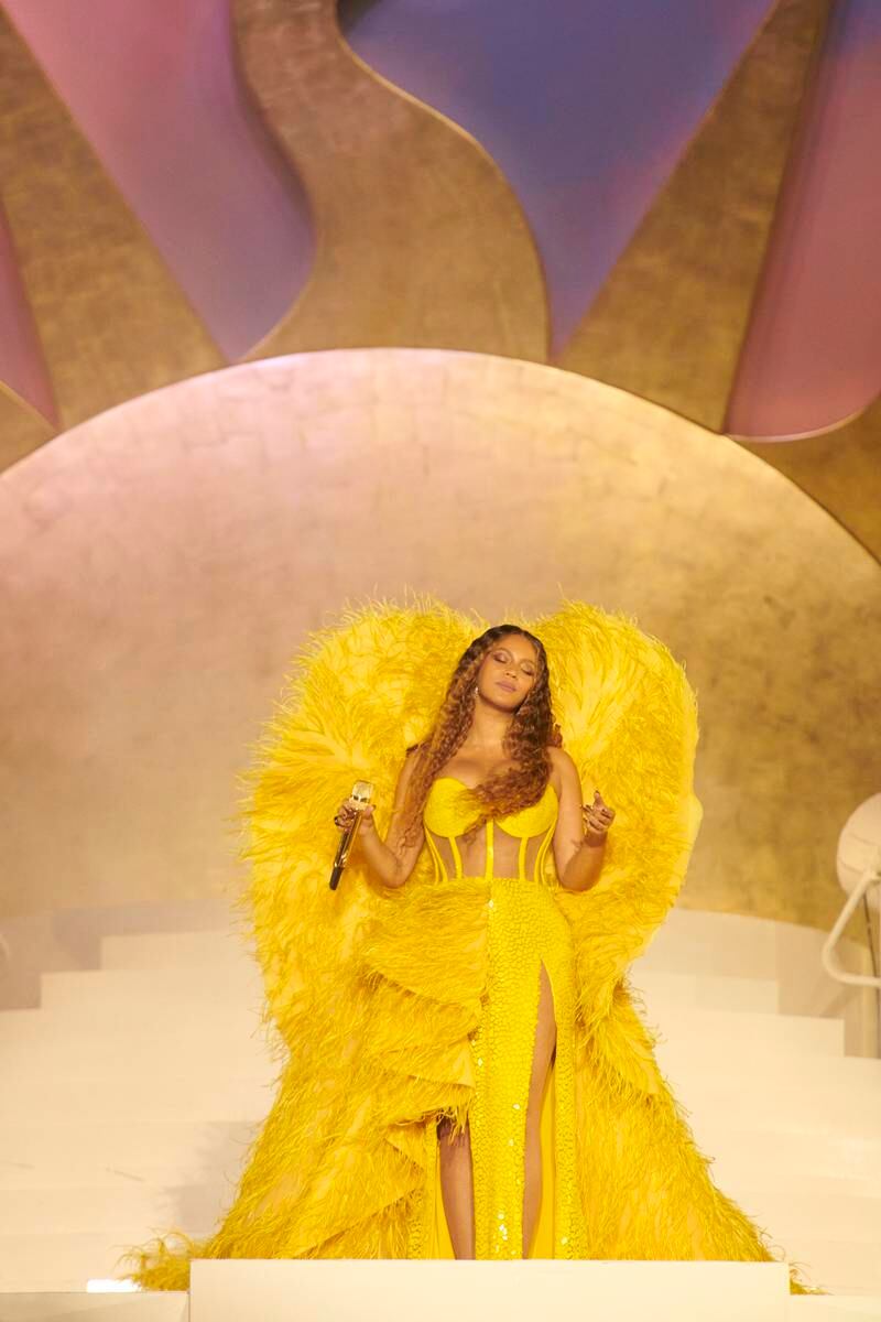 Another of her costumes was a yellow feathered dress by Atelier Zuhra. Photo by Mason Poole/Parkwood Media/Getty Images for Atlantis The Royal