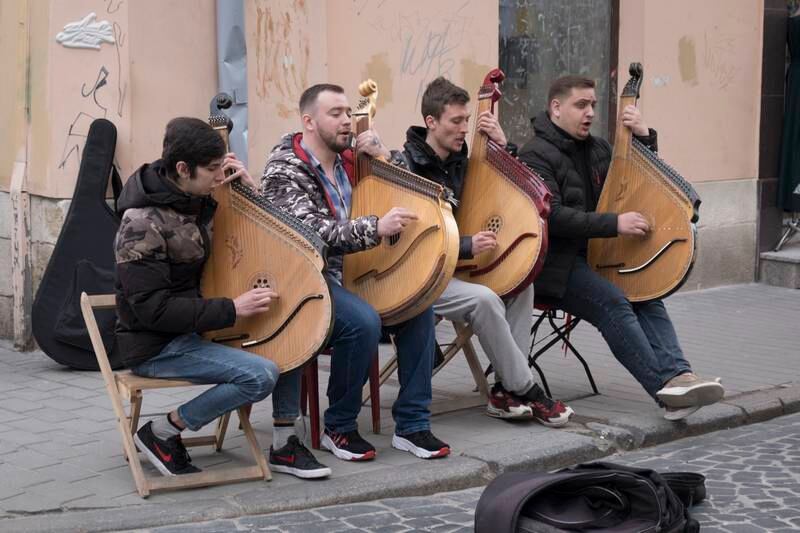 Buskers playing the bandura, a Ukrainian folk instrument, in the streets of Lviv. Photo: Oliver Raw