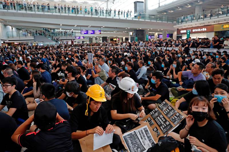 Anti-extradition bill protesters attend a mass demonstration after a woman was shot in the eye during a protest at Hong Kong International Airport, in Hong Kong, China.  Reuters