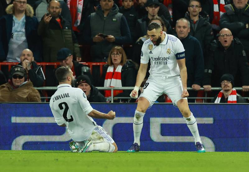 Madrid's Karim Benzema celebrates scoring their fourth goal with Dani Carvajal. Reuters