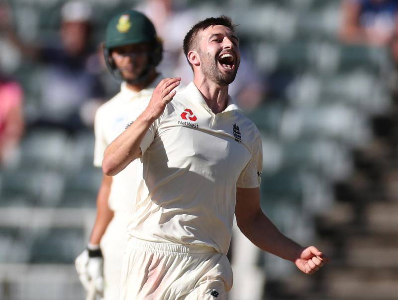 England's Mark Wood celebrates taking the final South Africa wicket of Anrich Nortje. Reuters