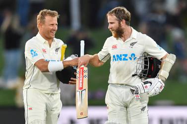 New Zealand's Kane Williamson (R) and Neil Wagner greet each other after winning the first Test match against Sri Lanka at Hagley Oval in Christchurch on March 13, 2023.  (Photo by Sanka Vidanagama  /  AFP)