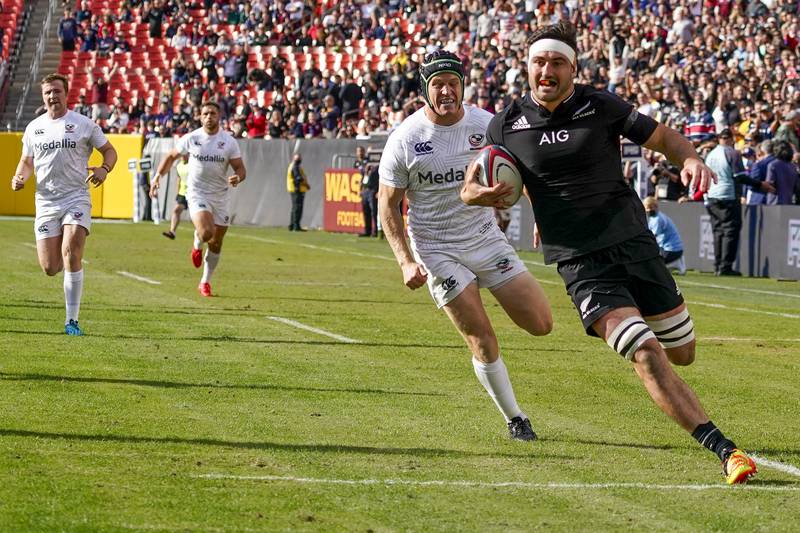 New Zealand's Luke Jacobson, right, runs in to score his team's first try. AP Photo