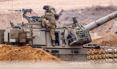 Israeli soldiers prepare for ground manoeuvres at an undisclosed location in Israel near the border with Gaza. EPA