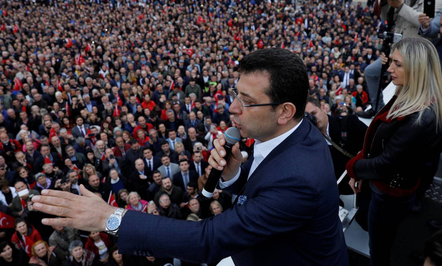 Main opposition Republican People's Party (CHP) mayoral candidate Ekrem Imamoglu addresses his supporters as he is accompanied by his wife Dilek Imamoglu during a gathering in Istanbul, Turkey, April 9, 2019. REUTERS/Umit Bektas