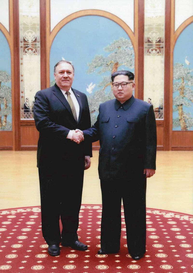 PYONGYANG, NORTH KOREA - UNDATED: In this handout provided by The White House, CIA director Mike Pompeo (L) shakes hands with North Korean leader Kim Jong Un in this undated image in Pyongyang, North Korea. Pompeo, now confirmed as Secretary of State, spoke with Kim for more than an hour during a secret visit over the Easter weekend.  (Photo by The White House via Getty Images)