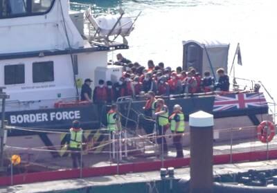 A UK Border Force vessel brings a group of people to the English coast on Monday, two days after six people died in a small boat crossing. PA