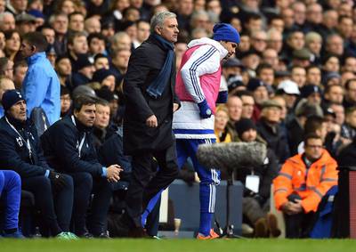 Chelsea's Diego Costa, right, passes manager Jose Mourinho as he goes to warm up during the English Premier League football match between Tottenham Hotspur and Chelsea at White Hart Lane in north London on November 29, 2015. AFP PHOTO / BEN STANSALL