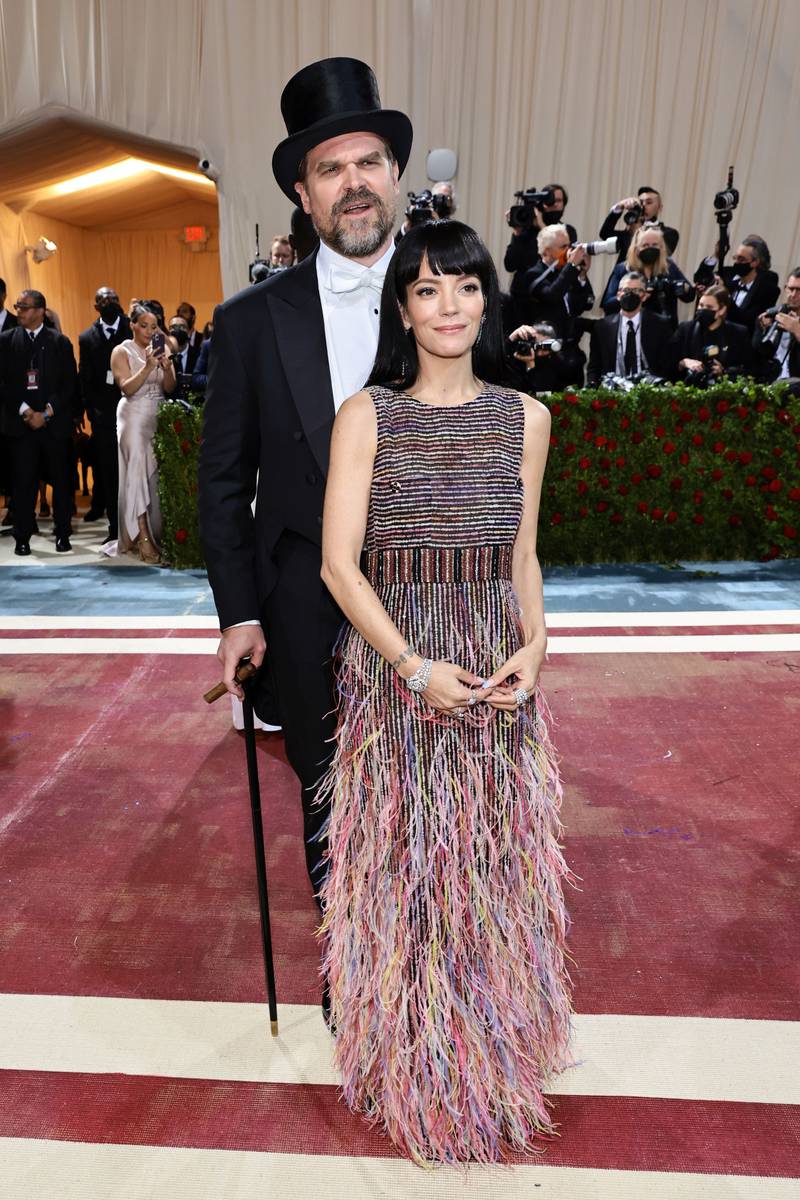Lily Allen, wearing a feathered Chanel gown, with husband David Harbour. AFP
