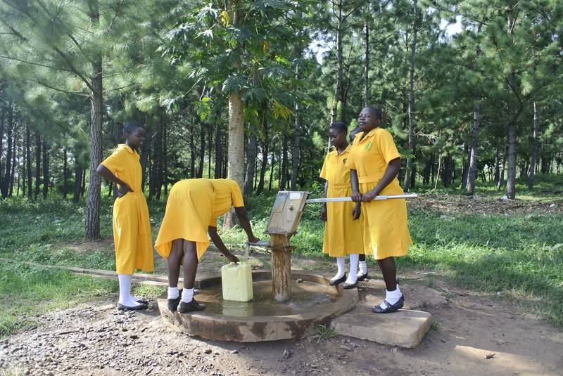 LIRA, UGANDA, Thursday, November, 23, 2017 // Pupils from St Katherine Secondary School collect water from a bore hole Thursday, November 23, 2017. St. Katherine Secondary School is one of 40 schools in 39 districts across Uganda to share in a US$1,188,280 donation from Dubai Cares aimed at promoting girls’ participation in stem subjects. In all, about 6,000 pupils, 500 science teachers and 40 head teachers will directly benefit from the funding, which is being managed and distributed by the Forum for African Women Educationalists – Uganda Chapter through 2019. (Roberta Pennington/The National)  