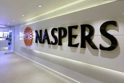 A logo sits on display inside the headquarters of Napsters Ltd., at the Media24 Ltd. office complex in Cape Town, South Africa, on Thursday, May 7, 2015. South Africa lacks a coherent economic policy and government departments are failing to work together, said Koos Bekker, billionaire and chairman of Naspers Ltd., Africa's biggest company. Photographer: Halden Krog/Bloomberg